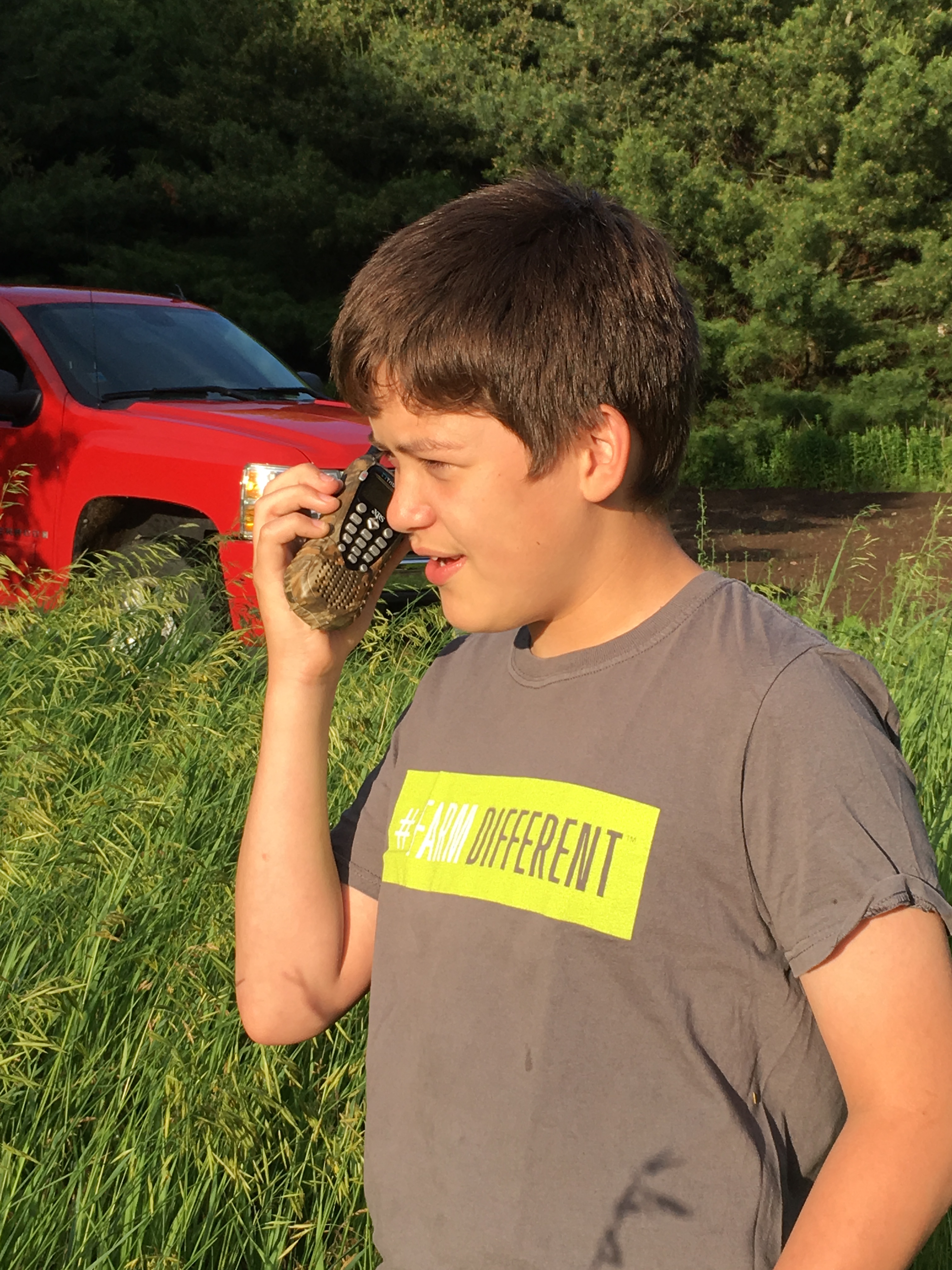 Boy communcating on 2-way radio